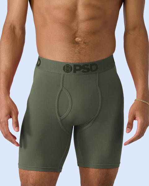 Forest green boxer briefs with PSD waistband on model shown from waist down.