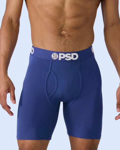 Man wearing blue modal boxer briefs with PSD waistband.